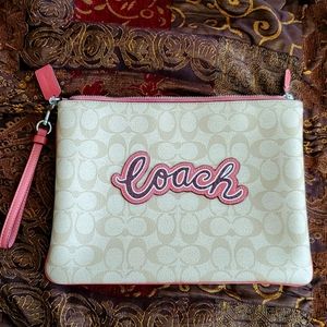 Oversized Coach wristlet. Excellent condition. No signs of use/wear